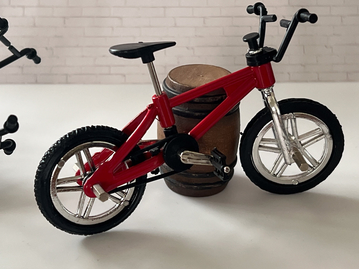 These realistic dollhouse metal bikes would definitely complete your dollhouse outdoor scene. They come in four colors: blue, yellow, red, and green.
These bikes have functional front and rear pegs, wheels that spin and handlebars that turn. __etsy:5455956663