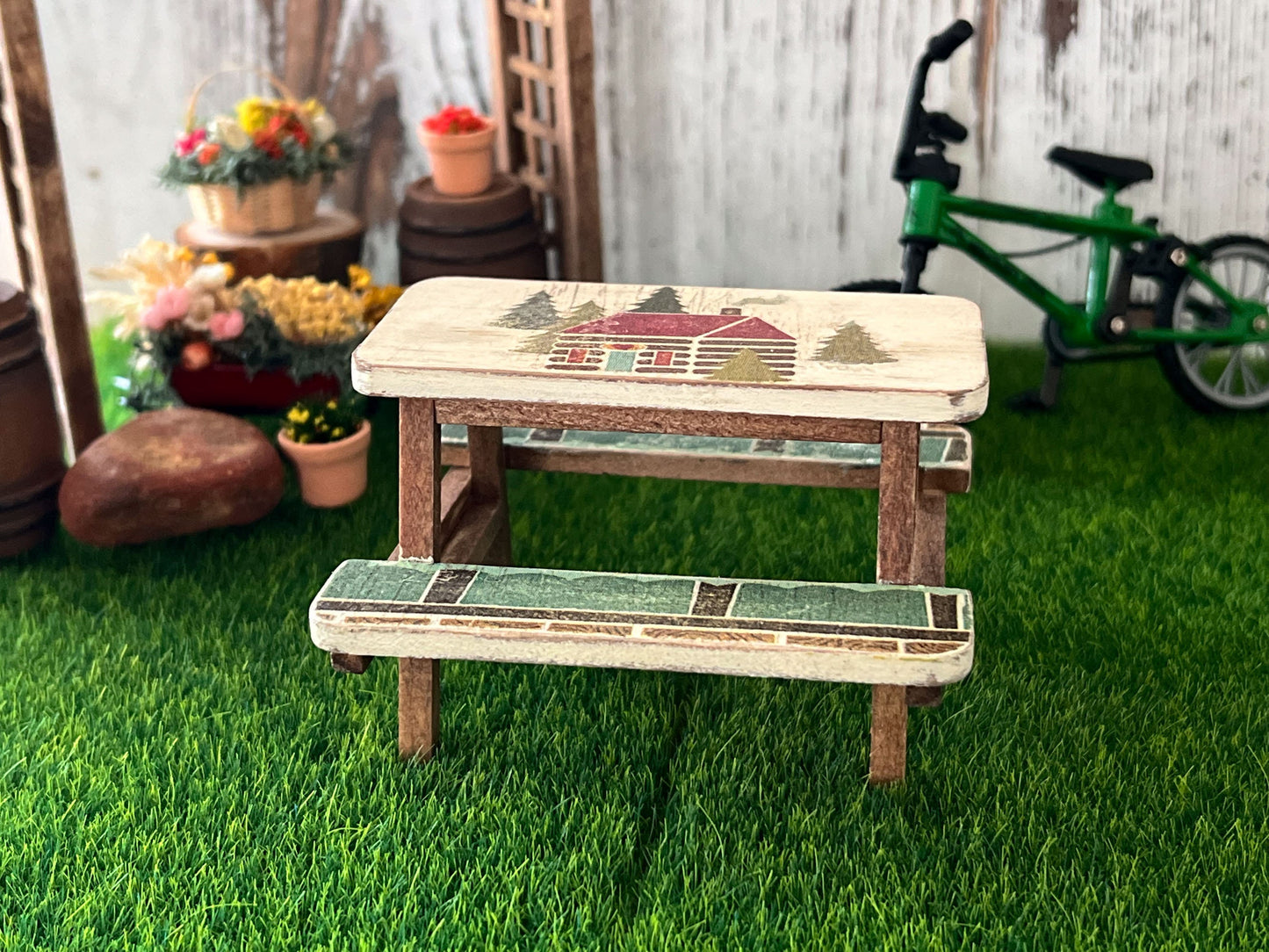 Adorable, handcrafted beige-brown wooden picnic table with a distress look and a cabin decoupage cut out. Perfect for a backyard or a park scene. Sturdy and perfect in every detail. __etsy:6332214327