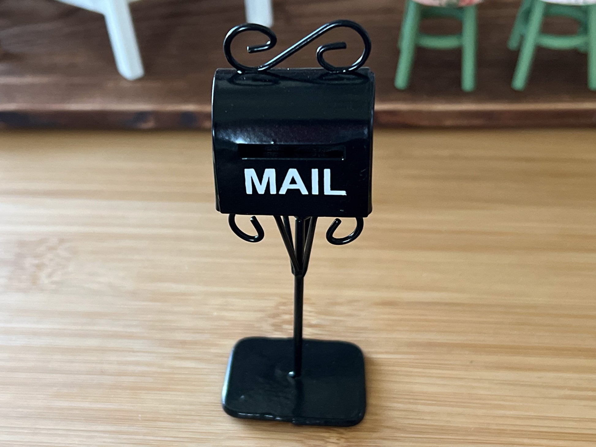 Adorable black standing tall metal mailbox, it sits in a good size platform that makes it sturdy when standing by itself. Comes in a shiny black with white text that reads "MAIL", has a slot for the letters and a decorative metal. __etsy:5854280802