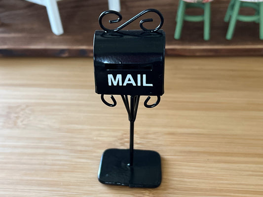 Adorable black standing tall metal mailbox, it sits in a good size platform that makes it sturdy when standing by itself. Comes in a shiny black with white text that reads "MAIL", has a slot for the letters and a decorative metal. __etsy:5854280802