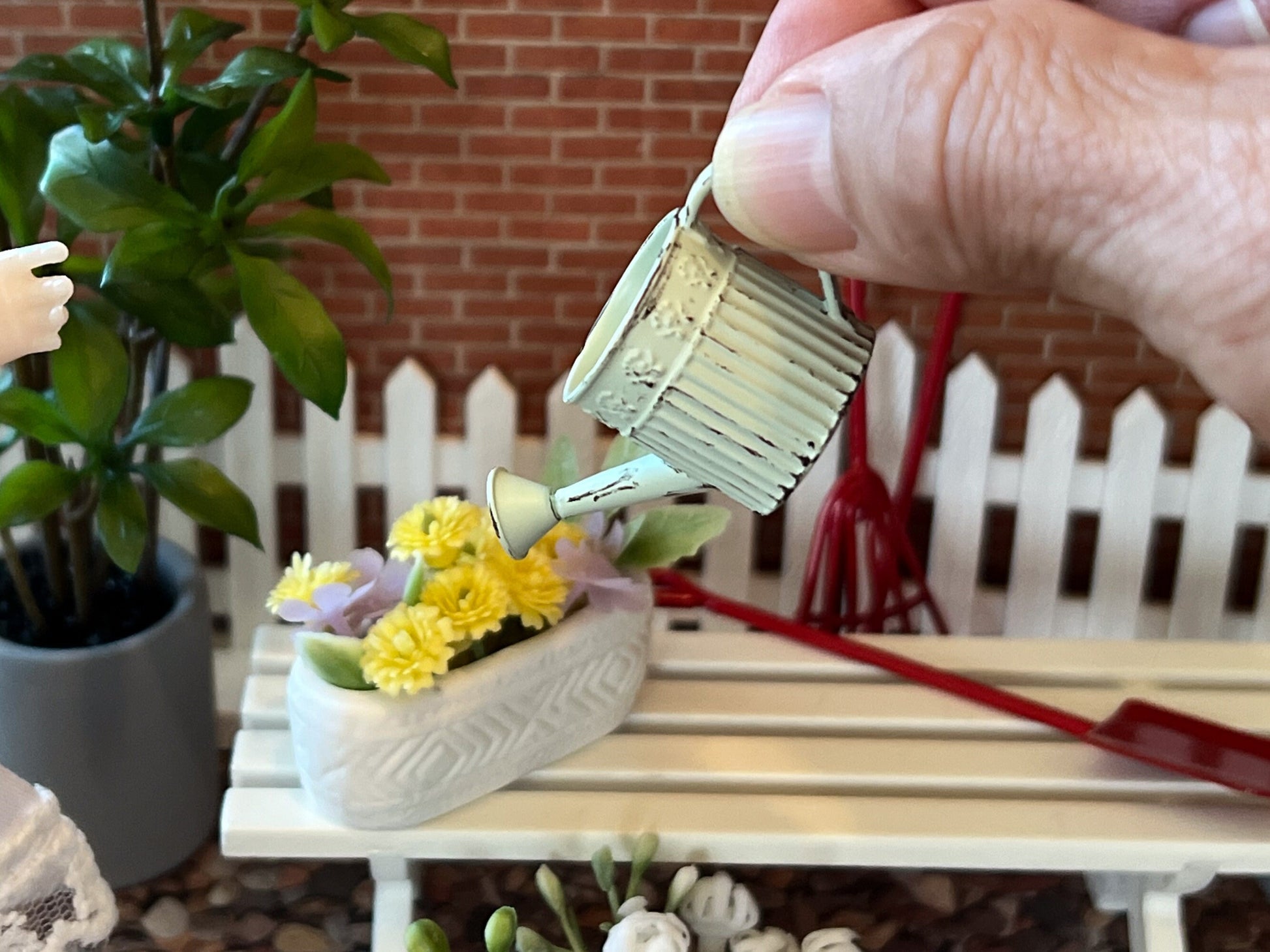 Dollhouse distressed metal watering cans, absolutely beautiful and perfectly made, they come in light blue, light green, and beige. Distinctive lace-like around top engraved flowers. These beauties would make your outdoor decor absolutely realistic. __etsy:6341875236