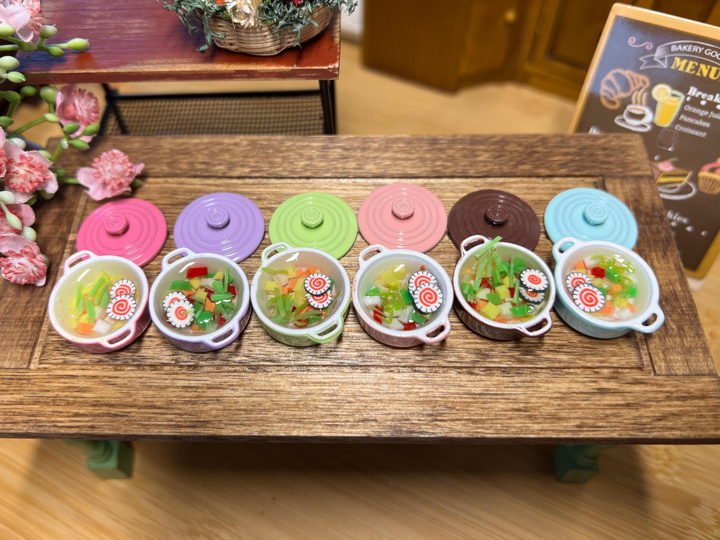 These realistic and cute metal Dutch ovens are filled with resin vegetable soup; they come in 6 different colors: lilac, brown, dark pink, green, pastel pink, and pastel blue. They are absolutely perfect, the soup is the cutest part. __etsy:6505843830
