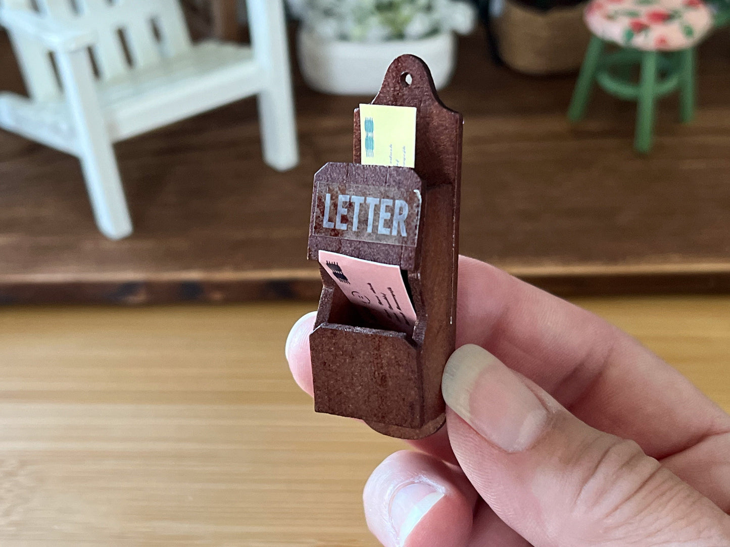 Organize your dollhouse with this adorable brown wood letter holder. This cute box features two mail holder cubbies, each filled with either a yellow or pink letter. __etsy:5858272466