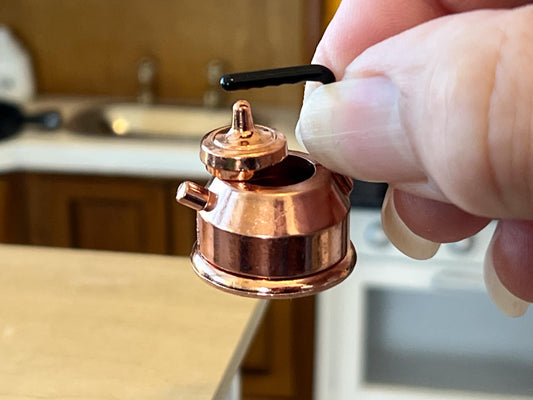 ☕ A Charming Antique Copper Kettle for Your Dollhouse!
This adorable 1:12 scale antique copper kettle is a must-have for any miniature kitchen or outdoor camping scene. Made of high-quality metal, this miniature kettle features a functional handle, an intricately detailed design, and a lid that opens—adding an authentic and vintage touch to your dollhouse. Whether displayed on a stovetop or nestled by a campfire, this realistic miniature kettle i __etsy:6758516075