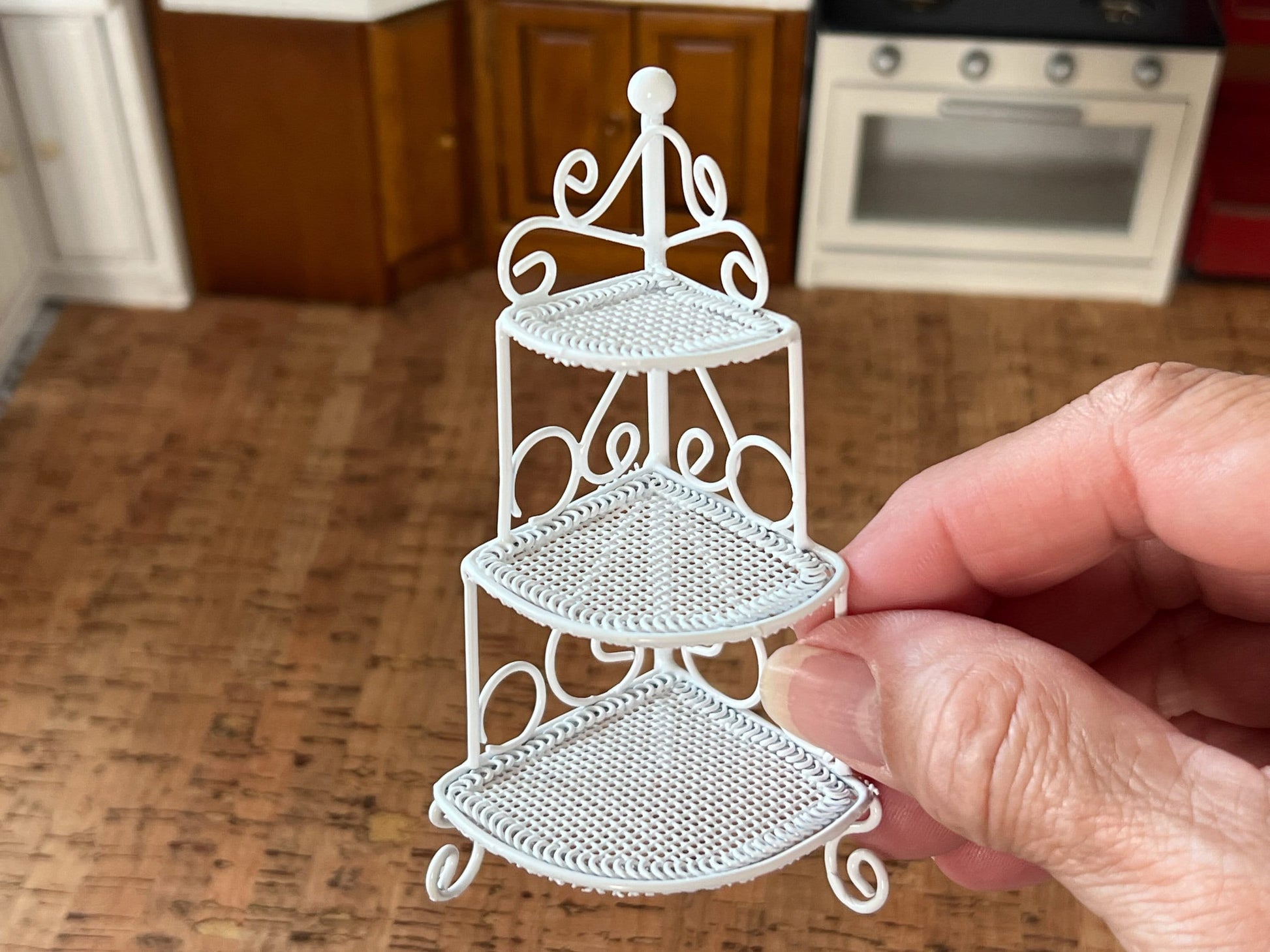 Add a charm to any space in your dollhouse with this miniature simulation wrought iron corner three tier plant shelf. This beautiful corner stand comes in white and has many realistic details. __etsy:6045080130