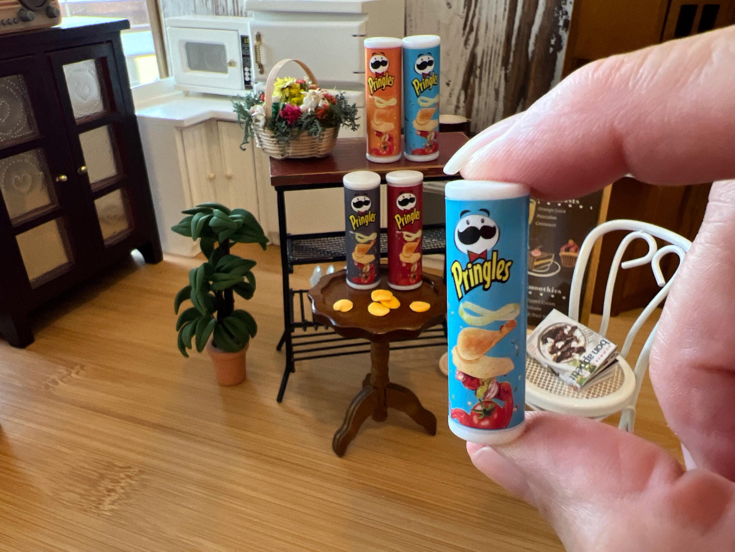 Dollhouse famous brand potatoes chips, it comes with the can that opens and potato chips inside, get it in red, blue, orange, or gray cardboard cans. Use it at your little house or restaurant, they are absolutely beautifully made. 
Size: 2"*.75" __etsy:6510634079